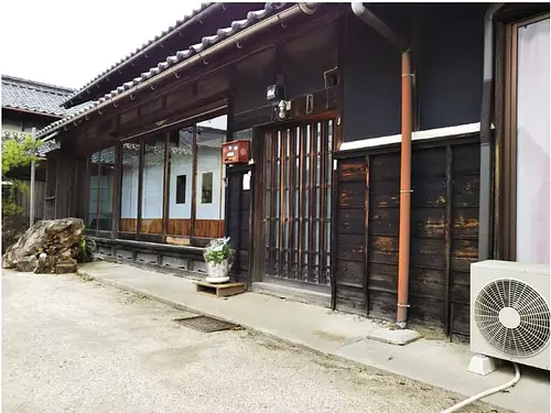 house with old trees